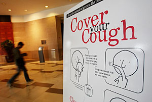 'Cubra su tos', reza un cartel contra la gripe A en EEUU. (Foto: Mario Tama | AFP)
